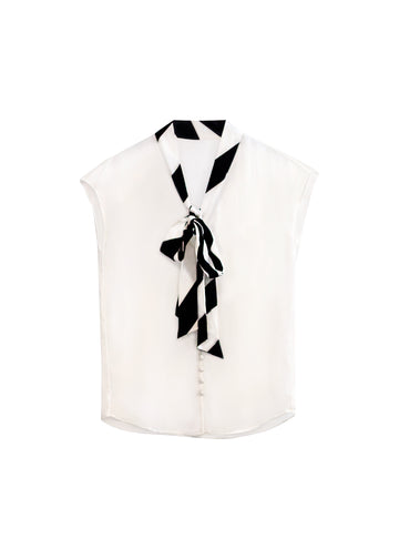 White sleeveless blouse with large bow tie